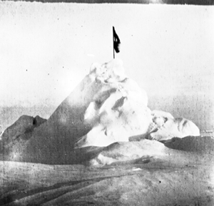Image of Snow/ice pile with flag at North Pole